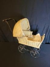 Antique wicker baby doll buggy