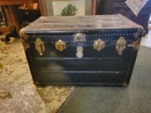 Antique leather wrapped steamer trunk