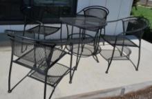 Round Black Metal Patio Table with Four Chairs
