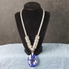 Unique silver tone necklace with large flashy blue pendant