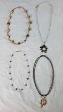 Lot of 4 costume jewelry necklaces Cookie Lee with silver tone sun pendant Square stone chunk Bico