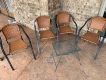 four outdoor chairs and table