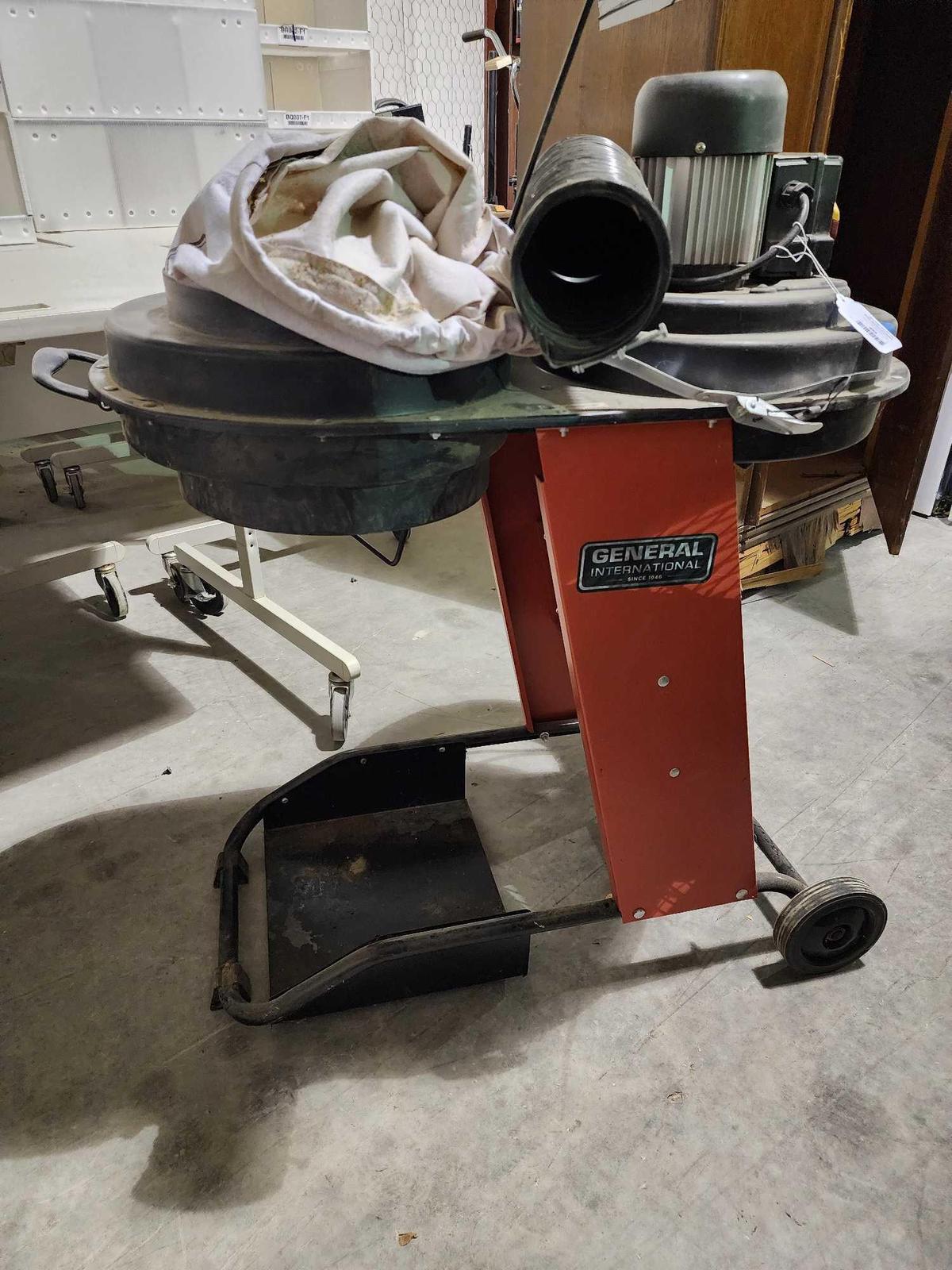 Electric saw dust catcher on wheeled cart with bag. Used.