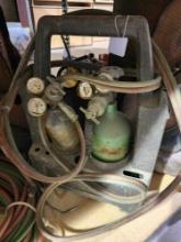 Small portable two tank acetylene/ oxygen bottles and torch gas lines. Used.