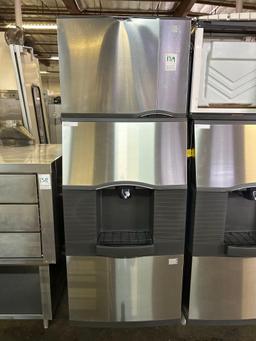 Manitowoc. 500 lb. Water Cooled Ice Maker on SPA310 Ice Dispenser Bin