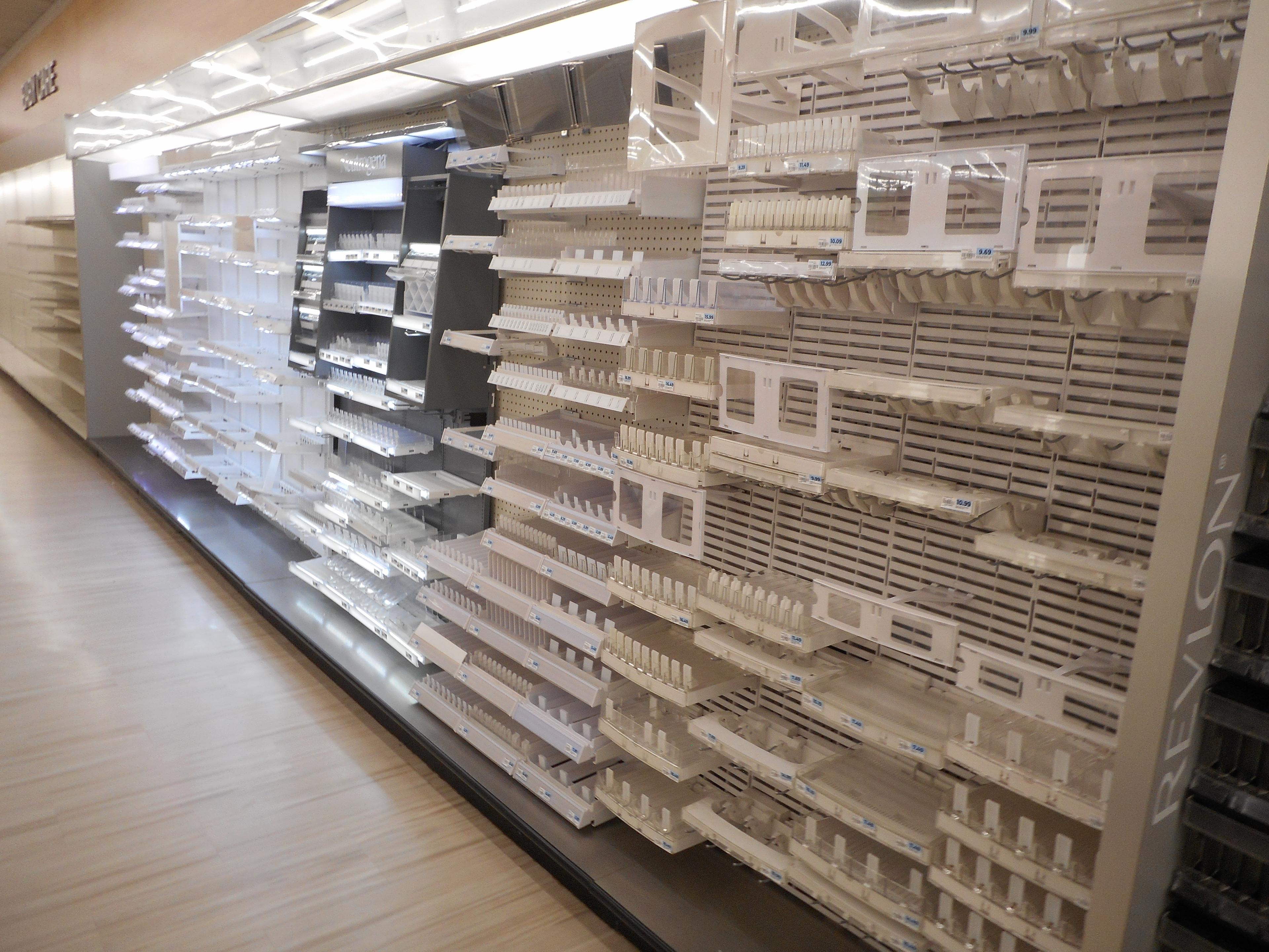 124 FT WHITE WALL SHELVING WITH COSMETICS DISPLAYS 84 INCHES TALL