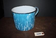 Blue and white enamel cup, black rim