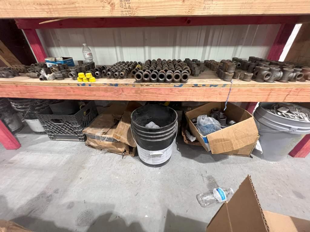 WOODEN SHELF WITH IRON PIPE FITTINGS AND PALLET OF BEAM CLAMPS
