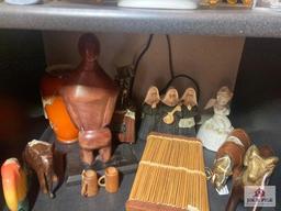 Lot of glass, wood, and pottery items on 3 shelves