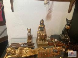 Lot Egyptian items and picture on wall, not the glass table of shelf
