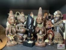 Lot of wood statues on shelf 8" to 11"