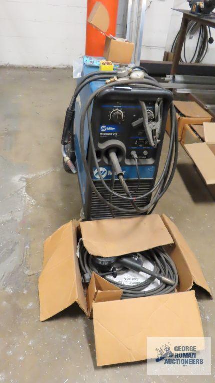 Millermatic model 210 welder with extra spool gun and accessories. Good working unit per seller.