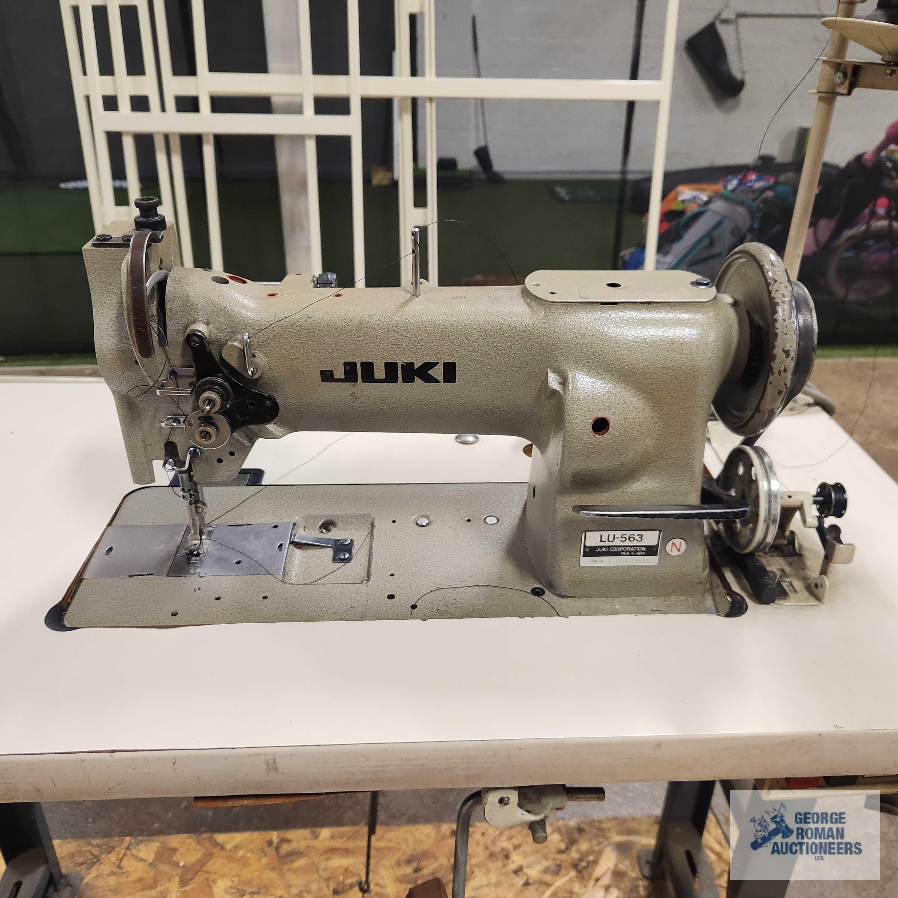 Juki model number LU-563 commercial sewing machine with fold-out platform