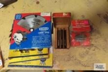 lot of taps, saws and lawn mower sharpener