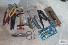 lot of utility knives, crescent locking pliers, channel lock style pliers and etc