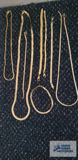 Gold colored costume jewelry necklaces and bracelets