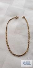 Thin braided bracelet, clasp needs repaired, marked 14K Italy, approximate total weight is 77 G