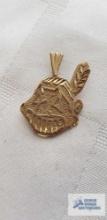 Cleveland Indians Chief Wahoo pendant, marked 14K MLB, approximate total weight is 1.72 G