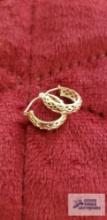 Gold colored cut out hoop earrings, marked 14K,...approximate total weight is .85 G
