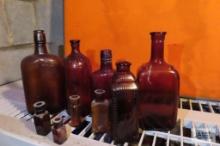 lot of antique brown bottles