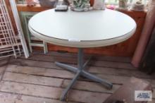 Round formica top table with metal base
