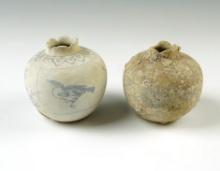 Pair of pottery vessels from the Hoi An Hoard with original catalog number stickers on bottom.