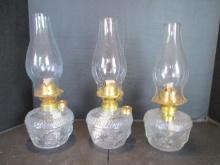 Three Clear Glass Star Design Oil Lamps