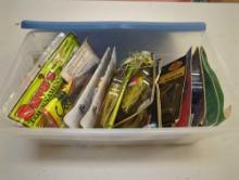 Blue Sterilite organizer tote and contents including various fishing lures of similar style. Comes