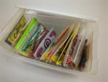White Rubbermaid organizer tote and contents including worms and other packaged fishing lures. Comes