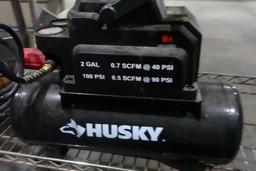 HUSKEY 2 GALLON PORTABLE AIR COMPRESSOR AND MISC TOOLS INCLUDING RIVET GUNS