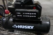 HUSKEY 2 GALLON PORTABLE AIR COMPRESSOR AND MISC TOOLS INCLUDING RIVET GUNS